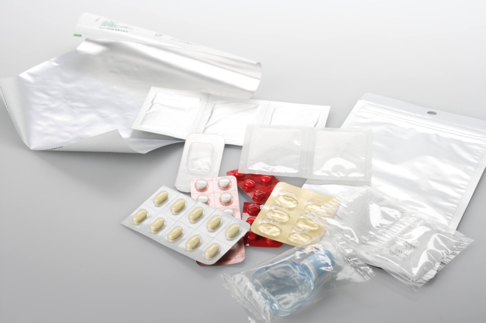 Pharmaceutical packaging film and PTP
